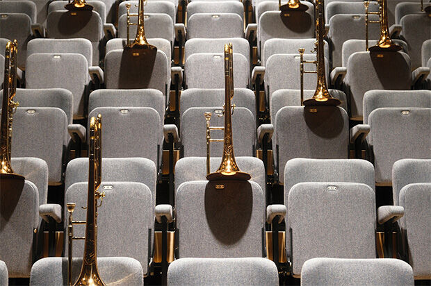 Trombones placed on theatre seats