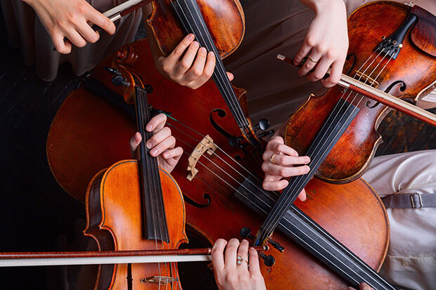 Close-up of string quartet and instruments from above