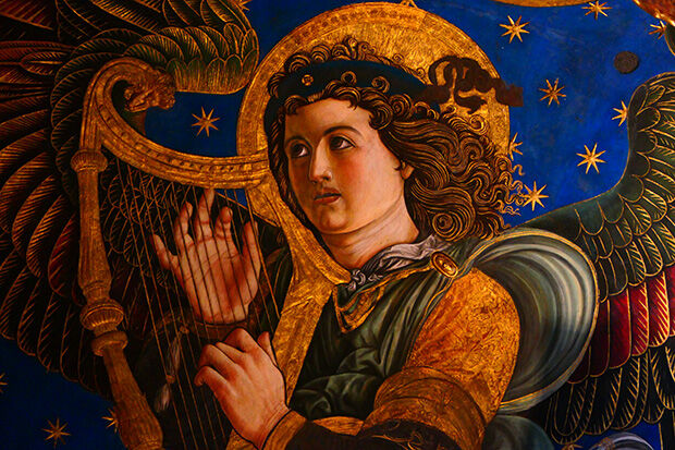 Renaissance painting of angel playing a harp
