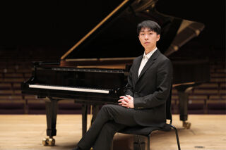 Pianist Jianing Zhao sat at the piano