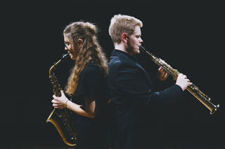 Saxophonists Amy Hunt and Andrey Fjelstad, back-to-back