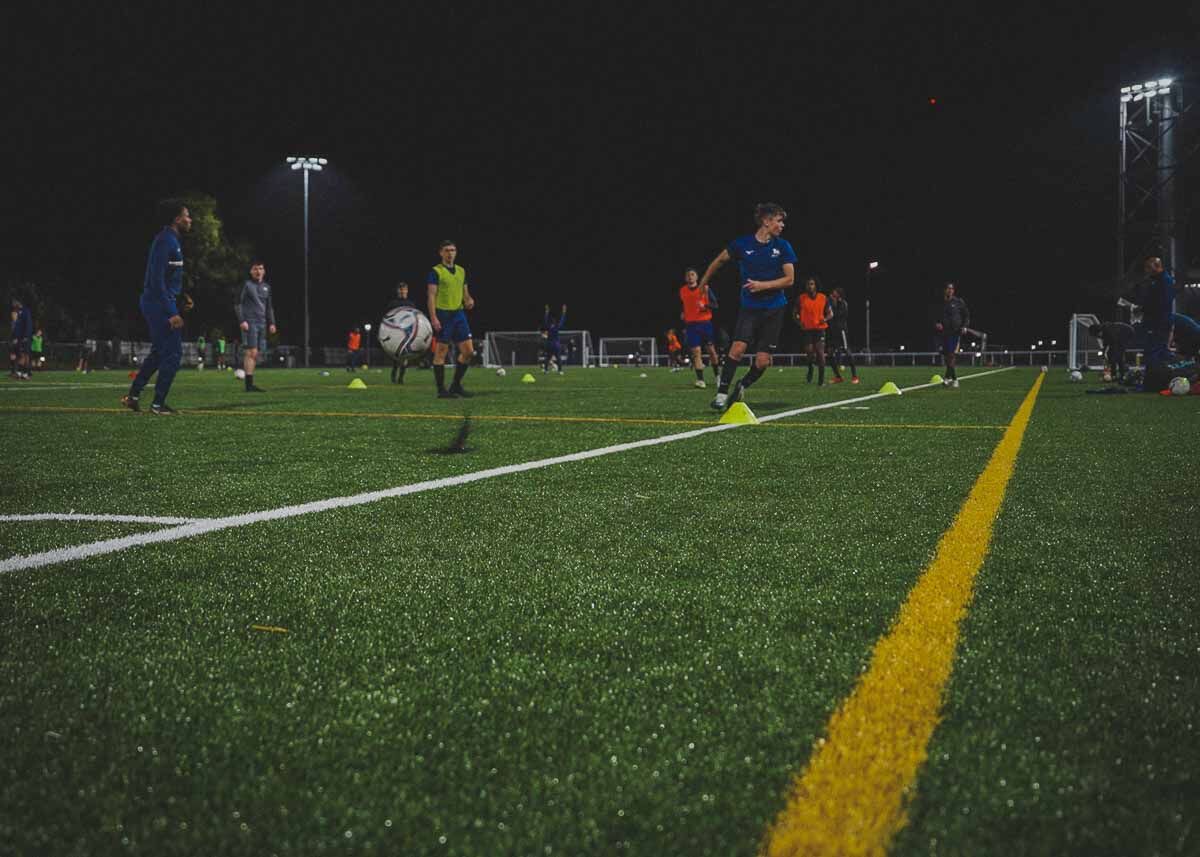Students playing football on 3G pitch at Alexander Stadium