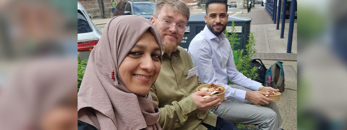 PGR Conference Selfie of 3 people sat eating lunch