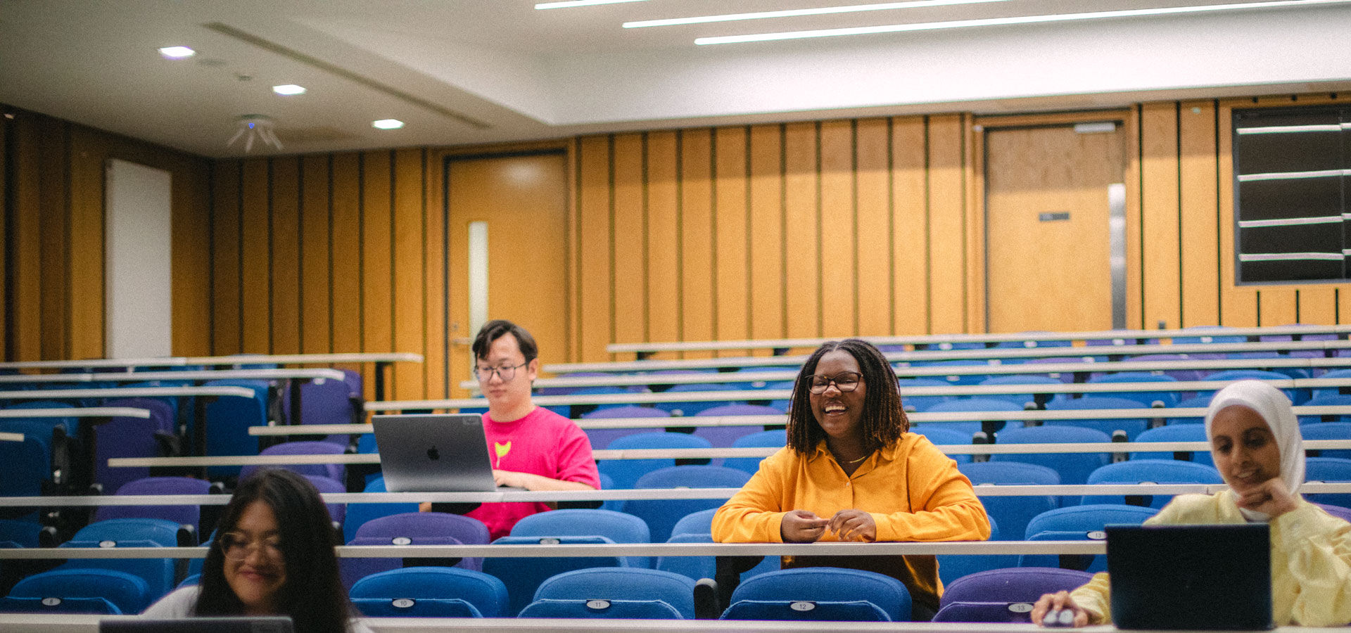Students sit in a lecture theatre