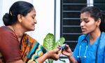 Nurse monitoring female patient