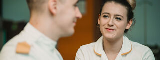 Two health apprenticeship students sat together