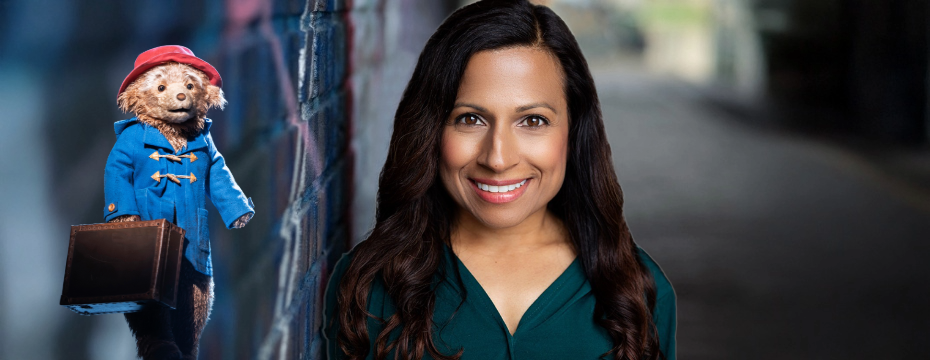 Arti Shah next to Paddington Bear in Paddington: The Musical (image by Johan Persson)