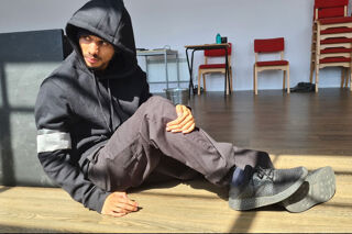 Male RBC acting student in hoodie