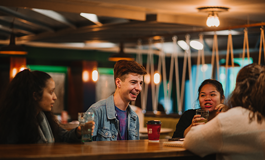 Students socialising with drinks