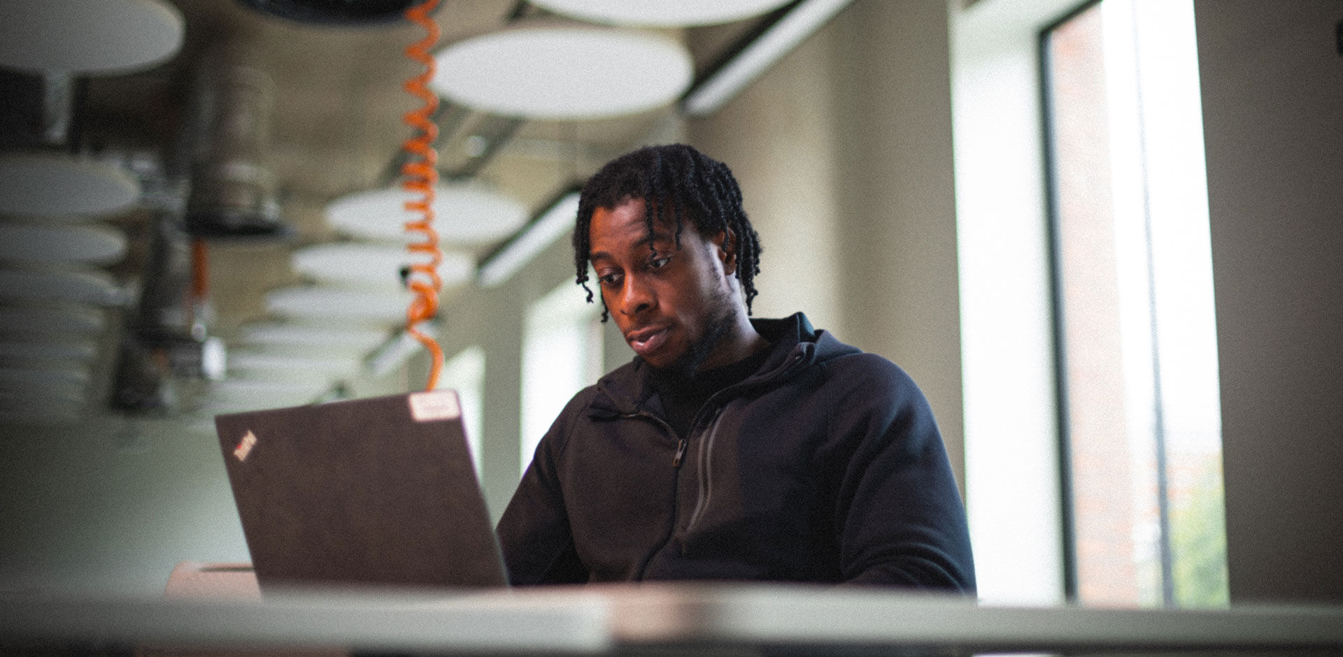 A student looks at his laptop
