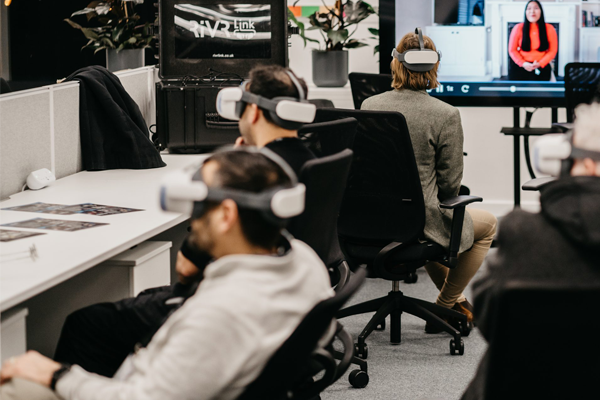 Image of the STEAMhouse Digital Labs with three people using VR headsets