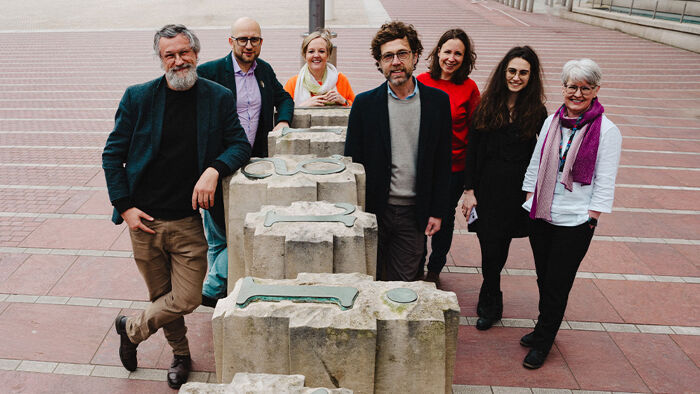 Group of researchers with typeface sculpture