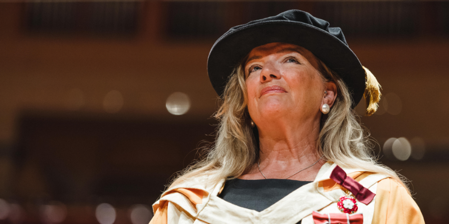 Janie Frampton accepting her honorary doctorate from Birmingham City University