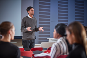 Photo of man talking at a workshop