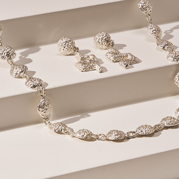 Jewellery and Silversmithing HND student work of silver necklace and earrings