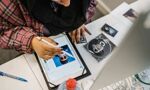 A student creating sketches on a tablet
