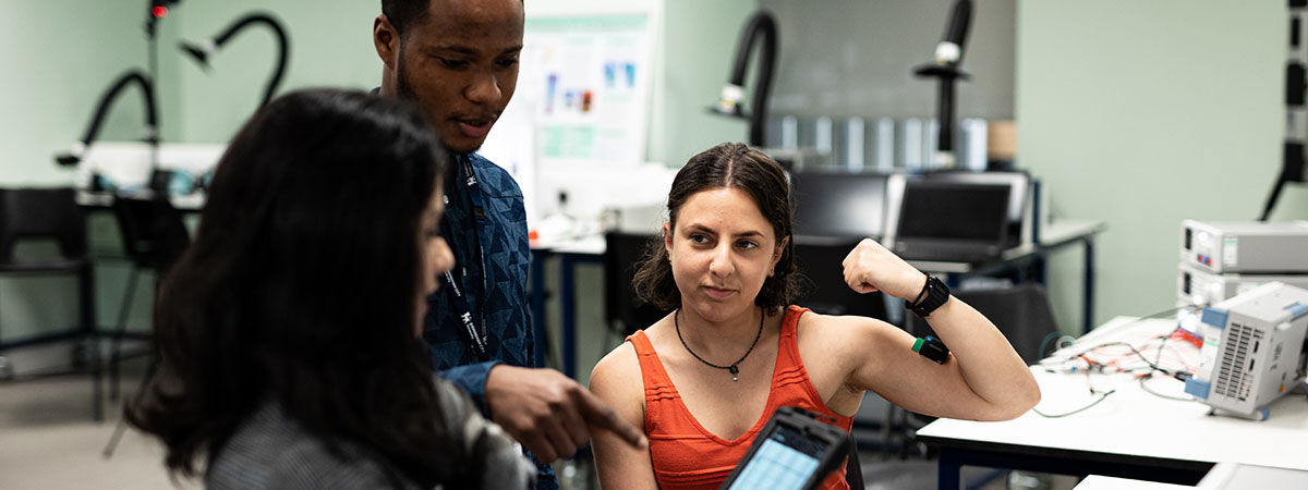 Two Biomedical students assessing patient