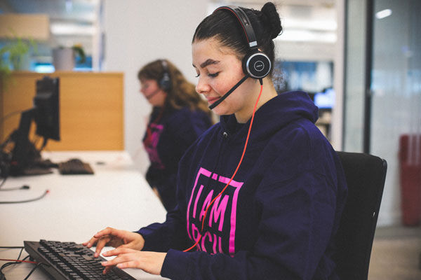 Clearing hotline worker takes a call