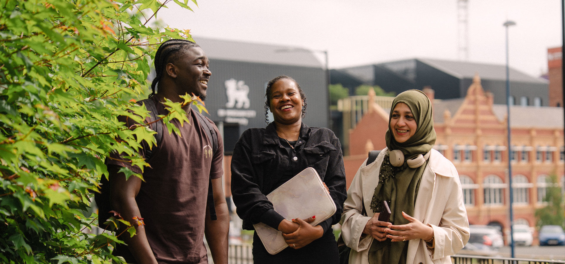 Three students walking and talking at City Centre Campus
