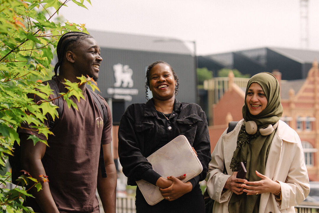 Three students walking and talking at City Centre Campus