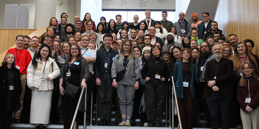 A group of around 50 people stood on a set of stairs.