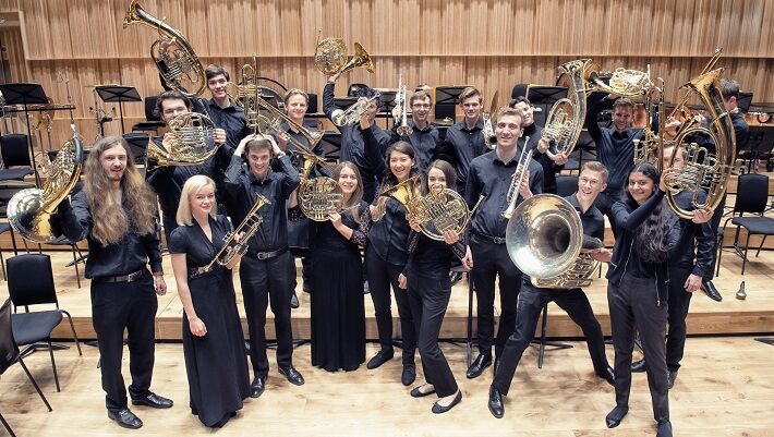 Group of brass student holding up their instruments
