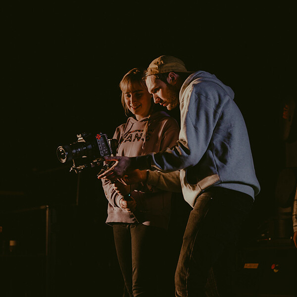 Students looking through a camera