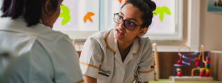 Nurse speaking with another nurse