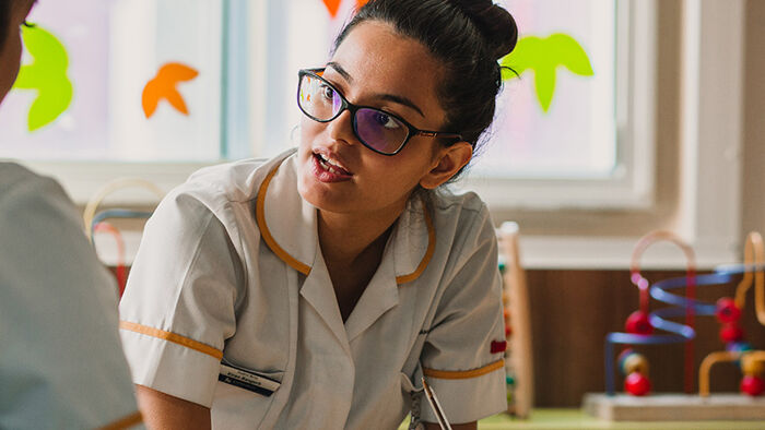 Nurse speaking with another nurse