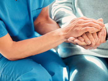 Photo of care home resident and carer