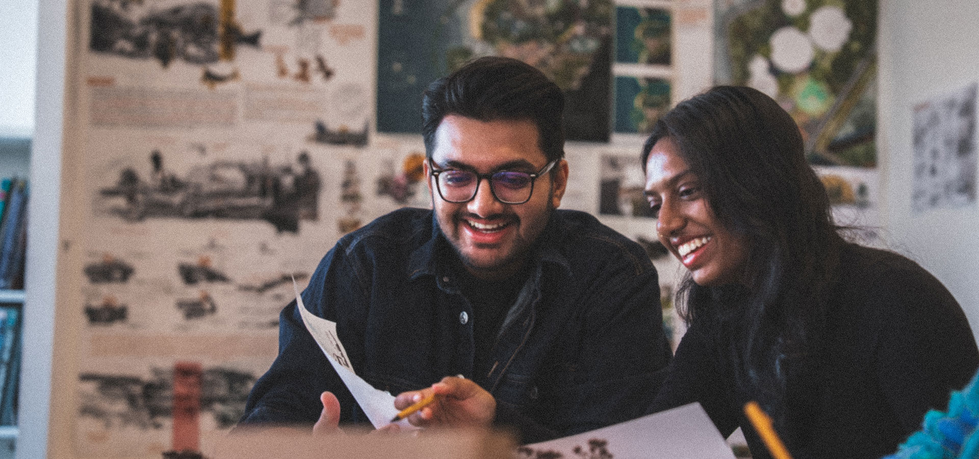 Two student talk in an architecture studio