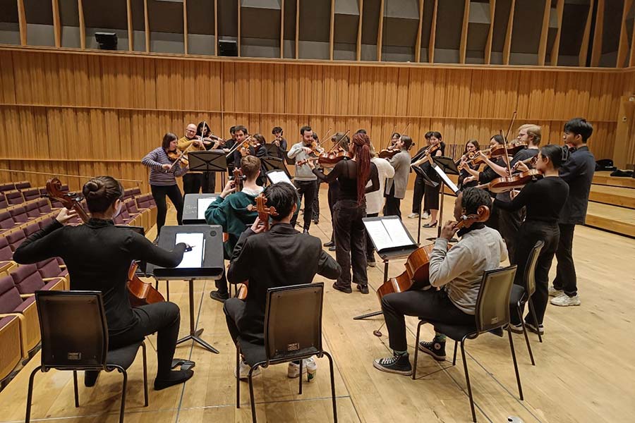 A group of students performing with musical instruments