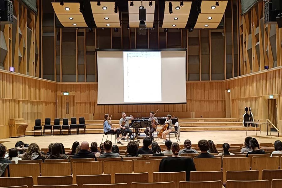 Students on stage with instruments