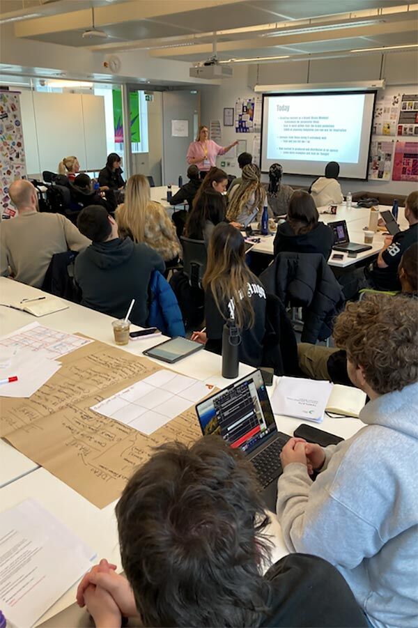 MA Future Media students in classroom with lecturer presenting