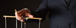Coercive Control 1200x450 - Man holding puppet strings
