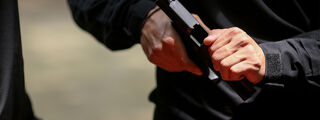 Man loading a handgun