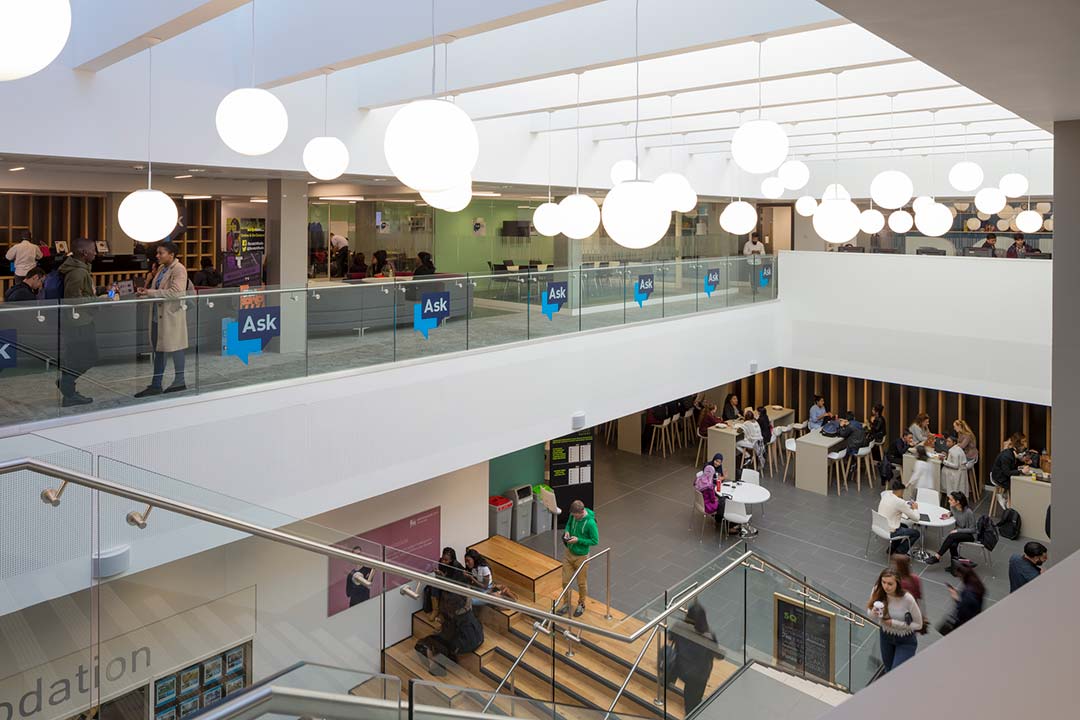 Curzon building with students in cafe