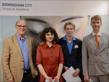 Competition winner Marcus Laing (third from left) along with the runners-up Alexandra Verejanu (second from left) and Andrew Hyatt (right of picture) collecting their prizes from Christopher Ward CEO Mike France (left of picture) Competition winner and BCU student Marcus Laing (third from left) alongside runners up receiving their prizes from Christopher Ward CEO Mike France (left of group)