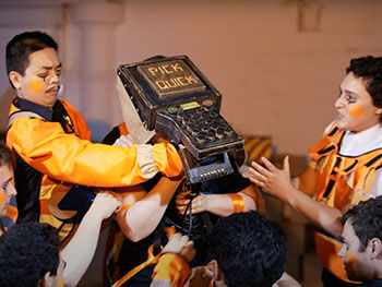Actors in film dressed in orange