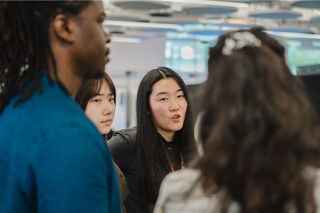 PhD students chatting together