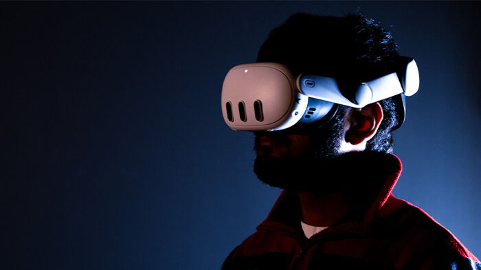 VR Headset on in blue room