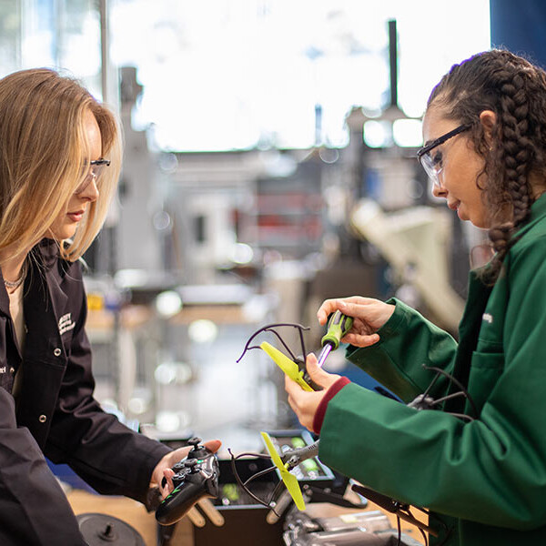 Two Electronic Engineering students building electronic project