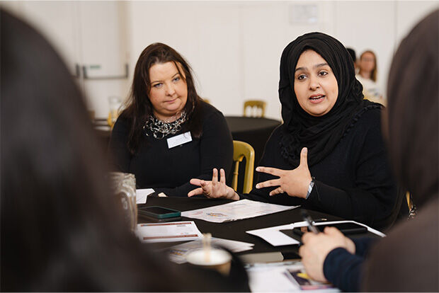 Student talking to employer