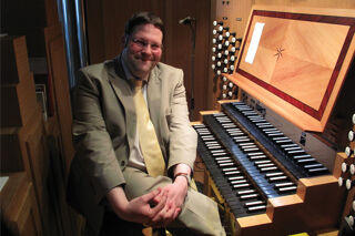Organist Henry Fairs sat at the organ in 2014