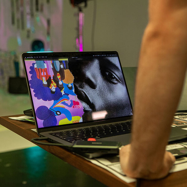 Student editing work on a laptop