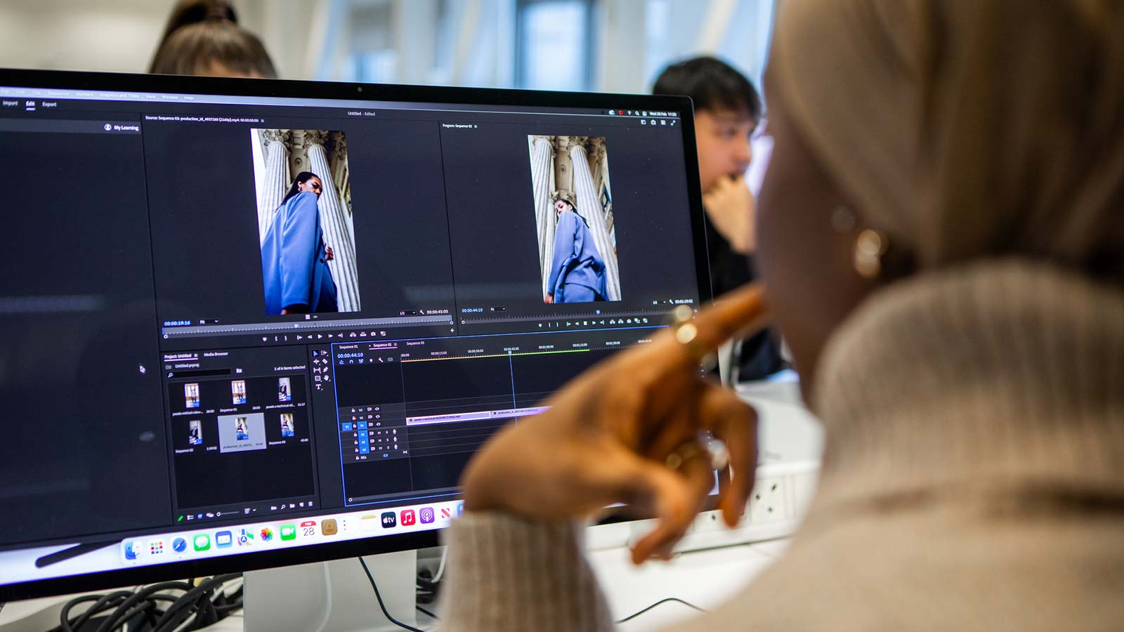 Fashion student designing on computer