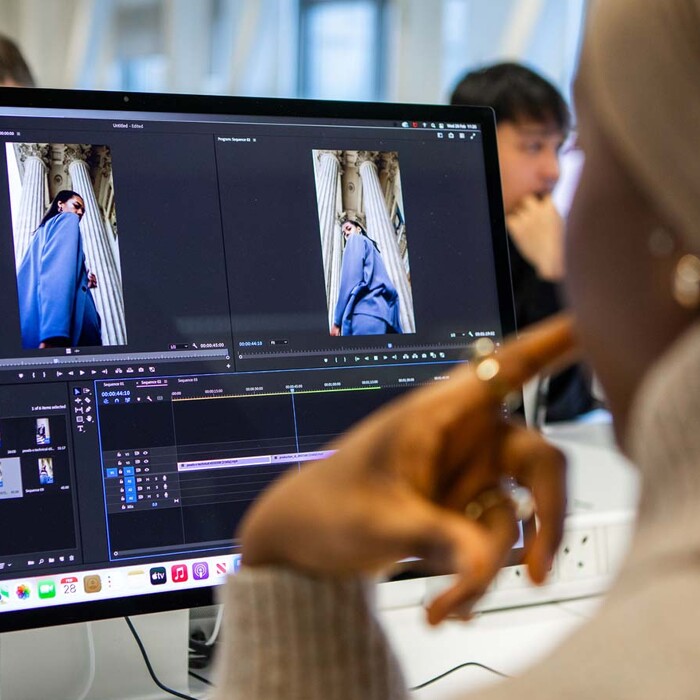 Fashion student designing on computer