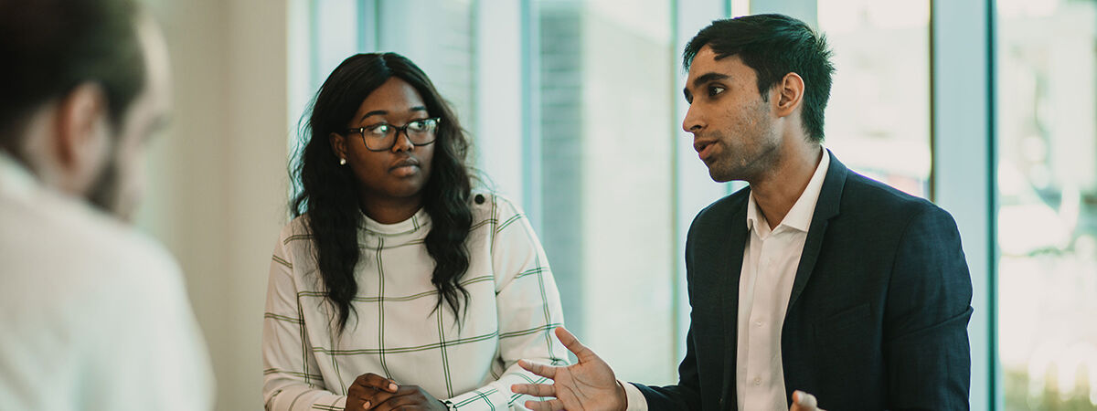 Finance and Investment MSc Course Image 1200x450 - Woman sat at a desk with a laptop