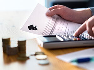 Calculator and financial documentation illustrating working out student finances