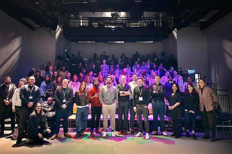 MA Future Media students and lecturers stood in large room at a convention